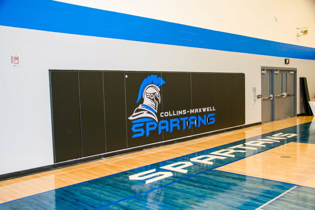 Custom wall pads for Collins-Maxwell Community school district in Central Iowa.